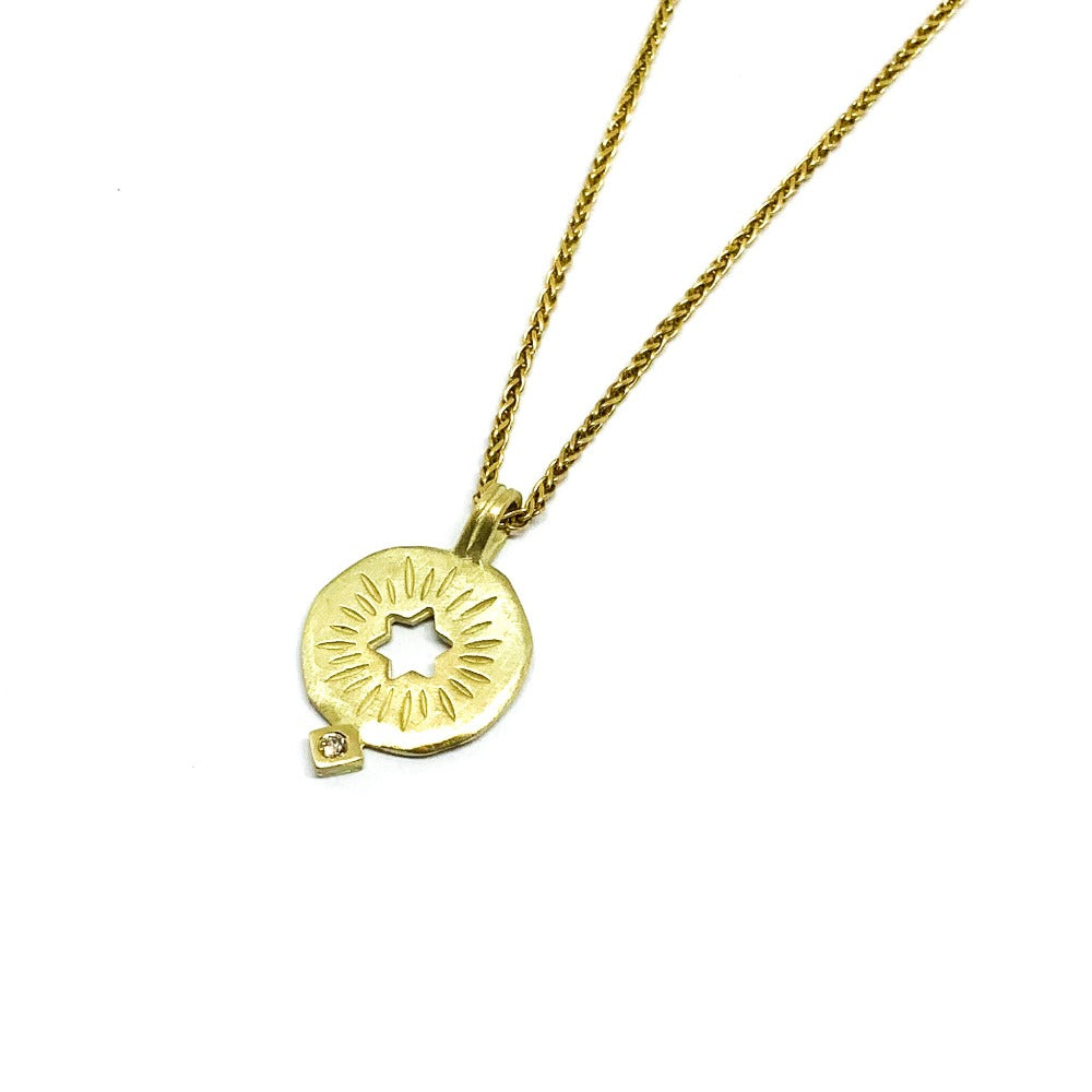 A golden rising star of david pendand on a chain