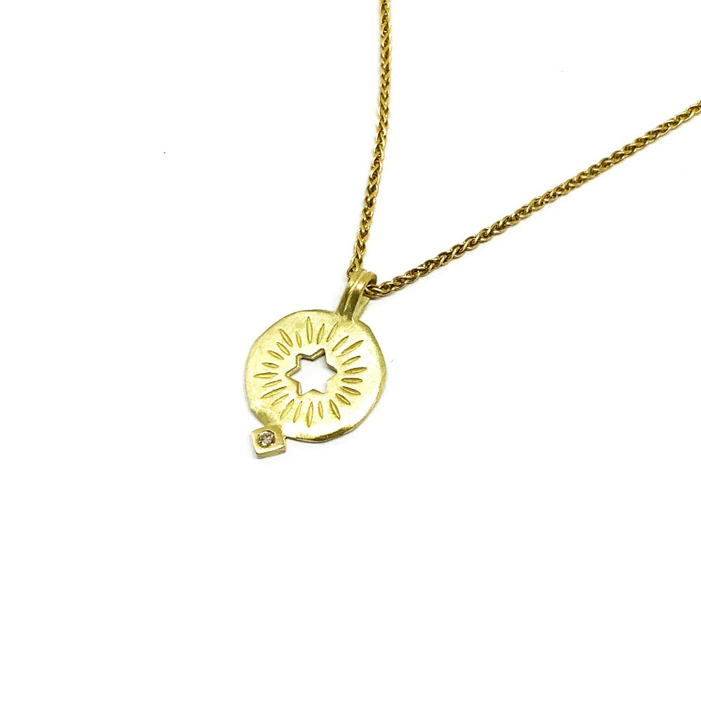 A golden rising star of david pendand on a chain