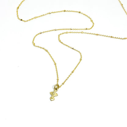 A golden necklace with a white diamond pendant 