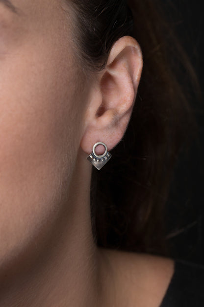 A pair of silver oxidized and brushed finish dotted rhombus earrings