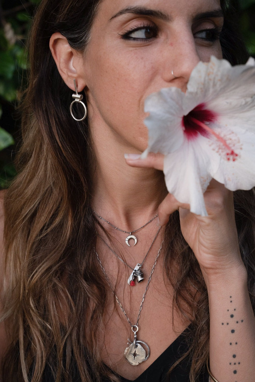 A pair of silver hoop earrings with a brushed finish, featuring a simple and elegant design.
