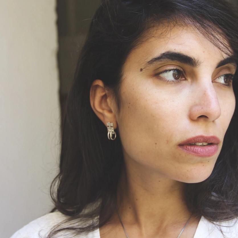 A pair of silver oxidized and brushed finish earrings with a geometric design