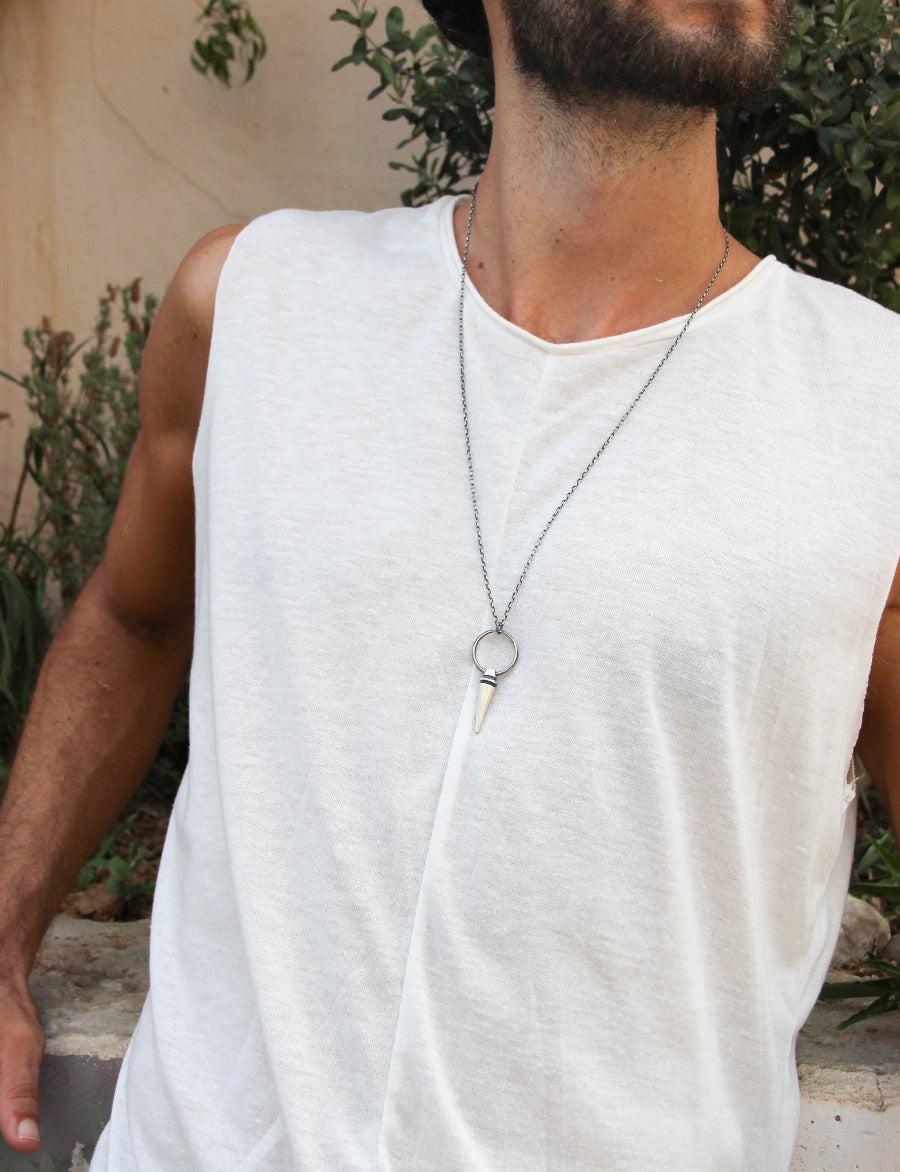 A sterling silver pendulum necklace with a brushed finish and a chain loop at the top. The pendulum is large and has a smooth, polished appearance.