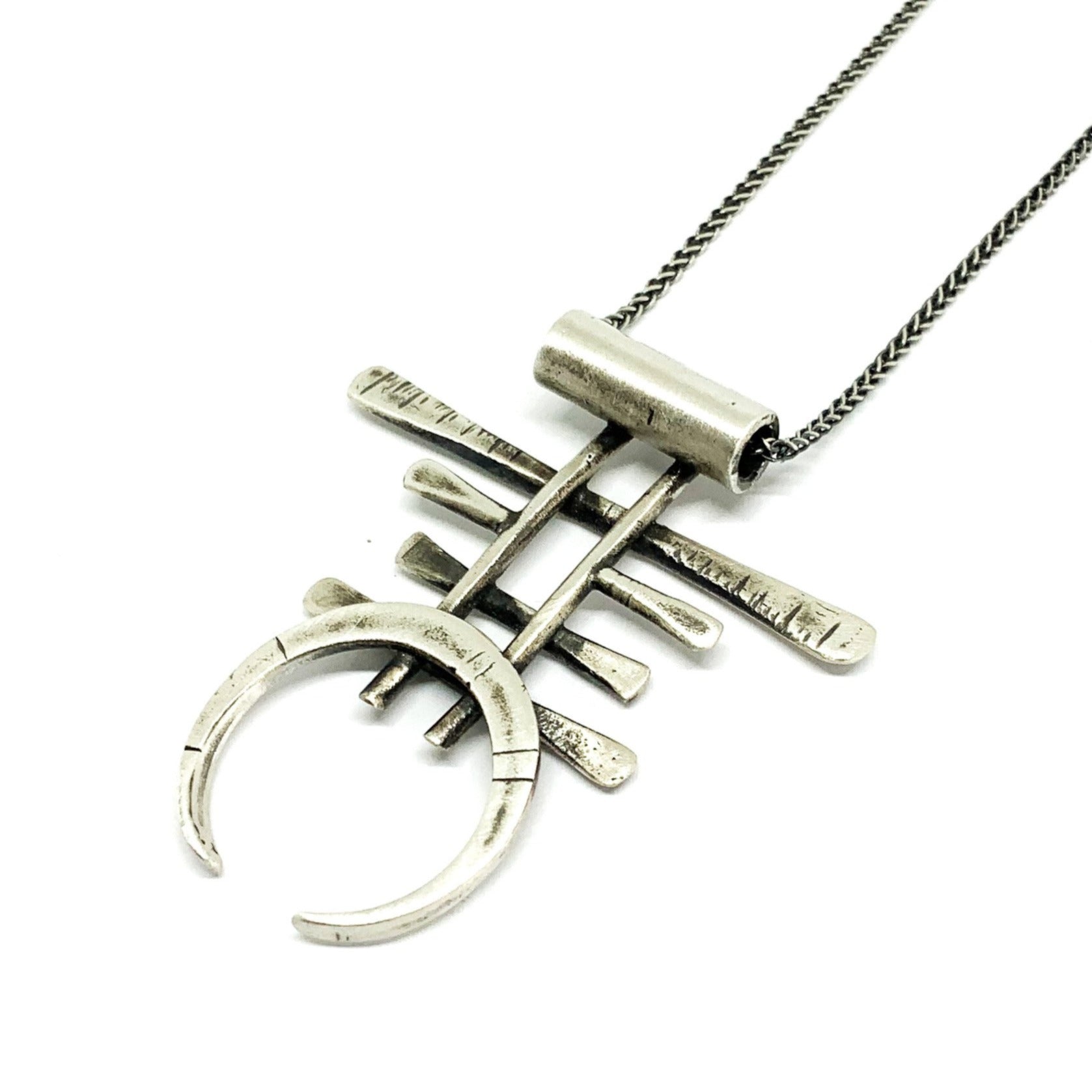 A necklace with a geometric silver pendant 