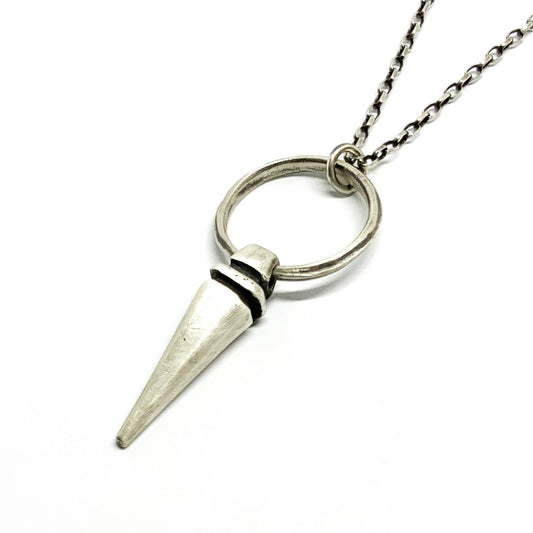 A sterling silver pendulum necklace with a brushed finish and a chain loop at the top. The pendulum is large and has a smooth, polished appearance.