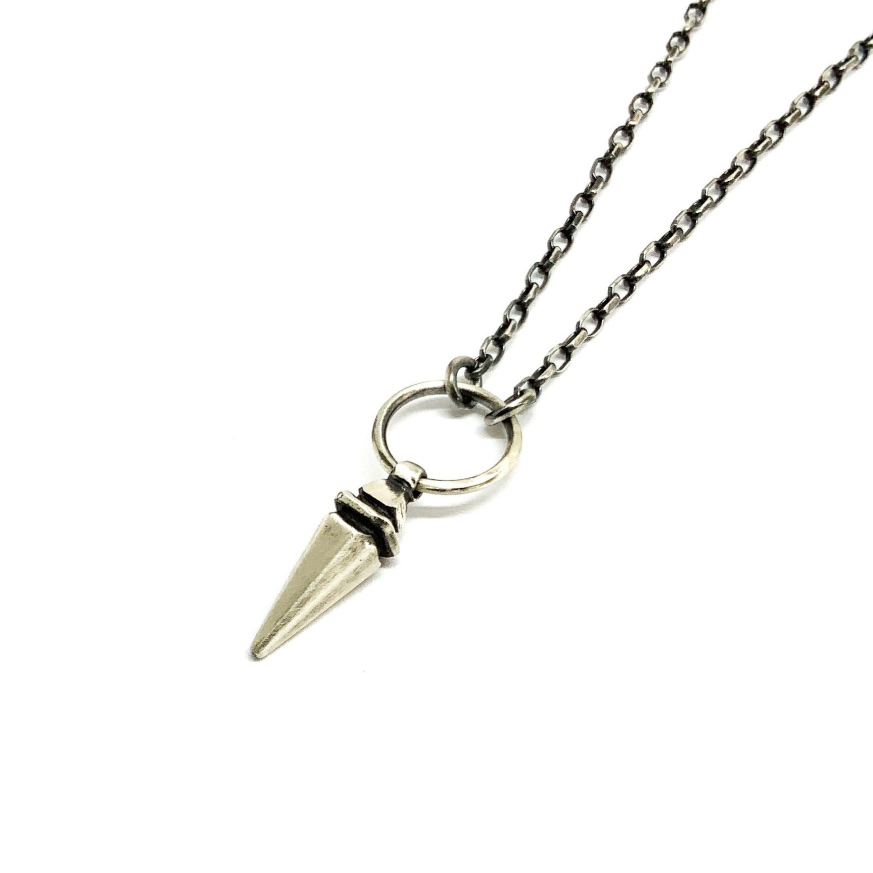 A sterling silver pendulum necklace with a brushed finish and a chain loop at the top.