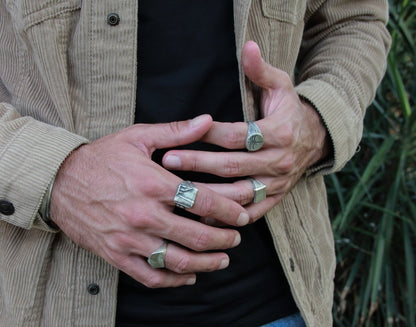 Men wearing 4 silver shelly ganz  silver rings
