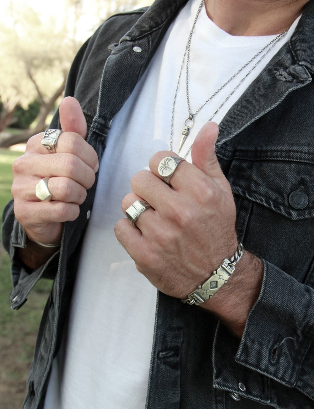 men wearing oasis ring carved memo ring, clean rock ring, transformation ring by shelly ganz