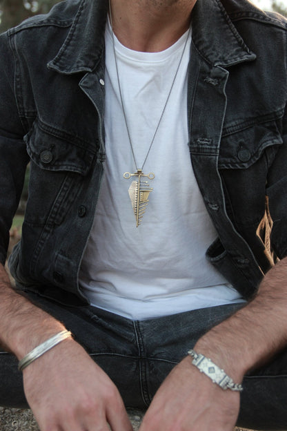 Men wearing silver and brass necklace 