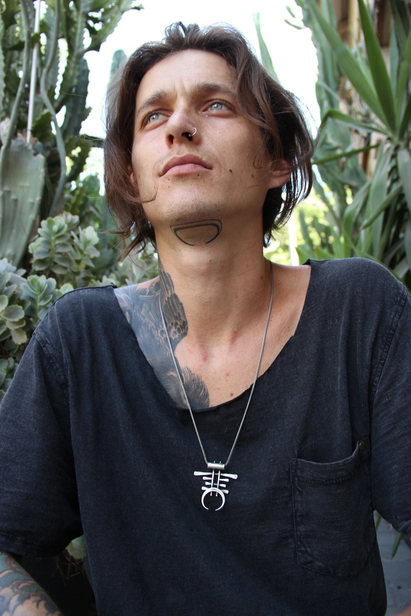 A necklace with a geometric silver pendant 