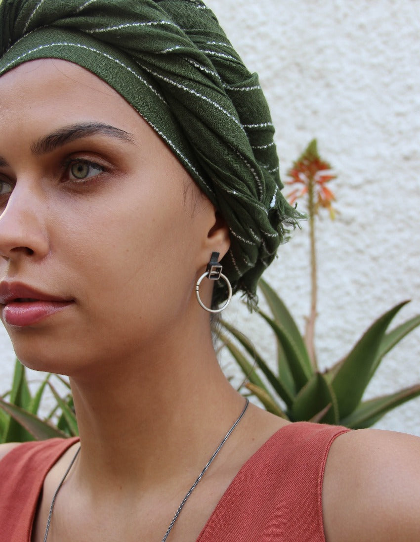 A pair of silver oxidized and brushed finish earrings with a geometric design