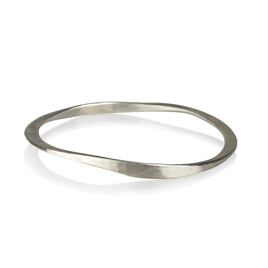 A silver bracelet with a brushed finish