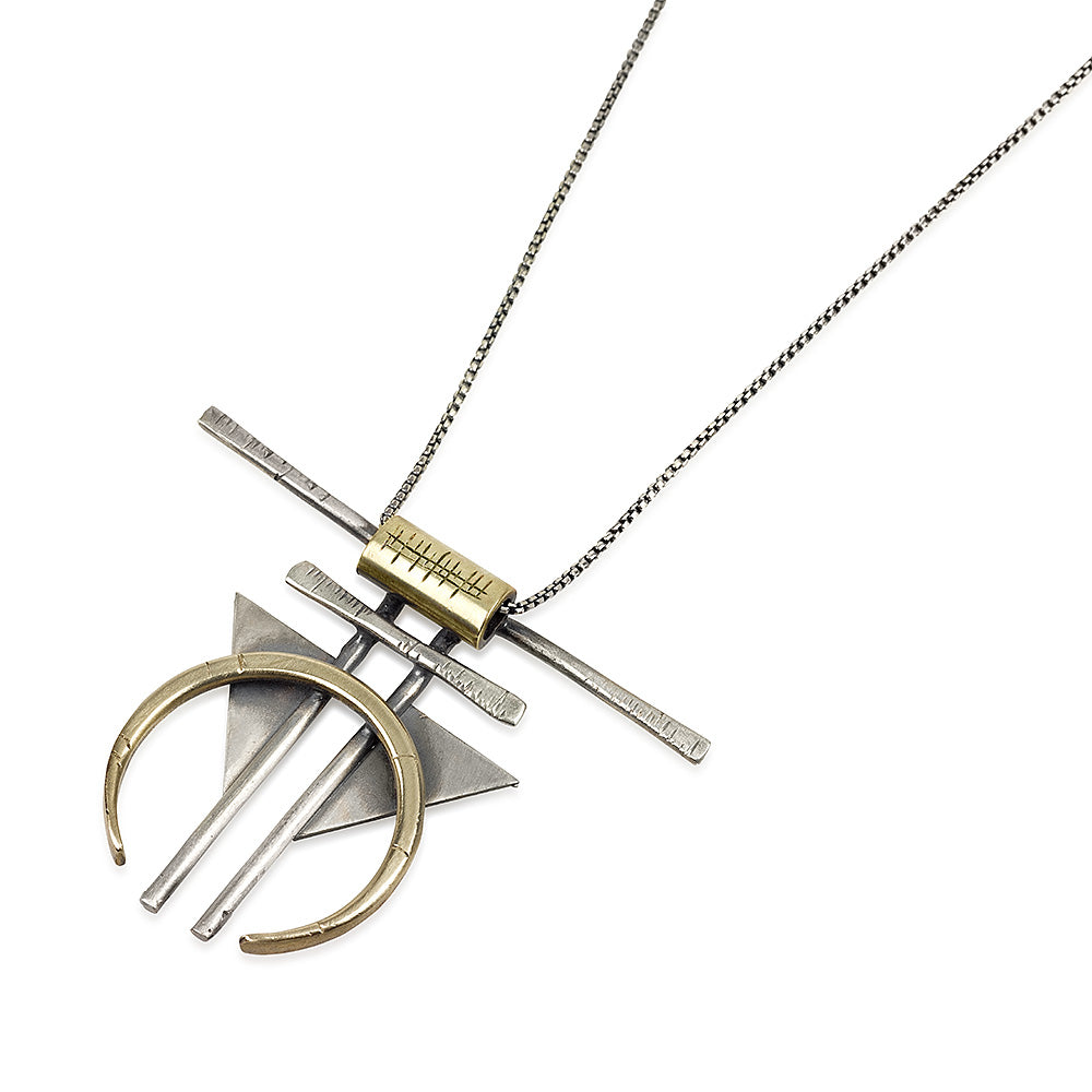 A silver and gold-colored necklace with a geometric pendant, featuring a chain and a series of geometric shaped pendants attached to it.