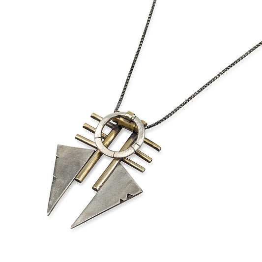 A necklace with a geometric silver pendant featuring a combination of brushed and oxidized finishes, attached to a chain.