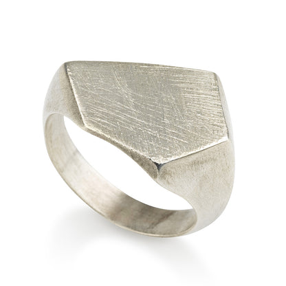 A silver ring with a geometric cutout design on the top part, with a matte finish.